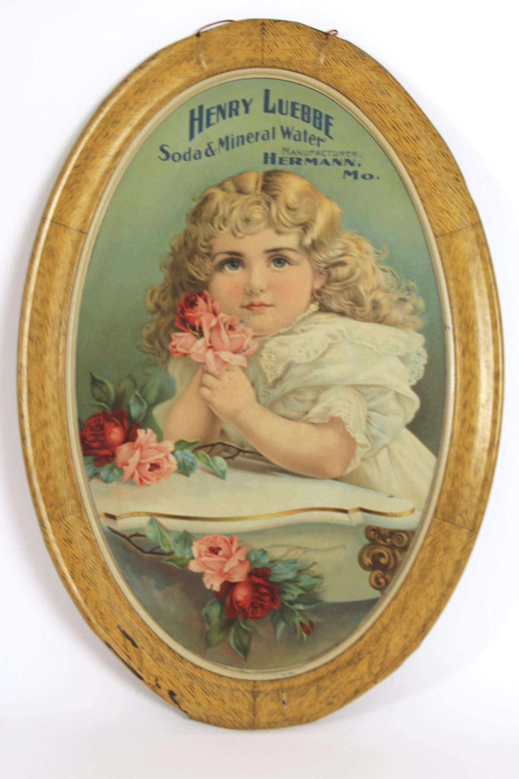 Henry Luebbe Soda & Mineral Waters Self-Framed Tin Sign, Hermann, MO. 1890